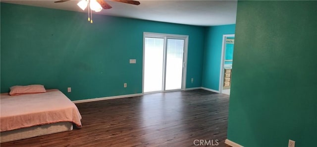 bedroom with ceiling fan, baseboards, and dark wood finished floors