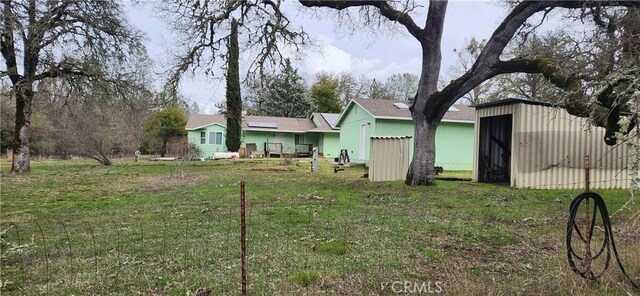 view of yard with an outbuilding and an outdoor structure