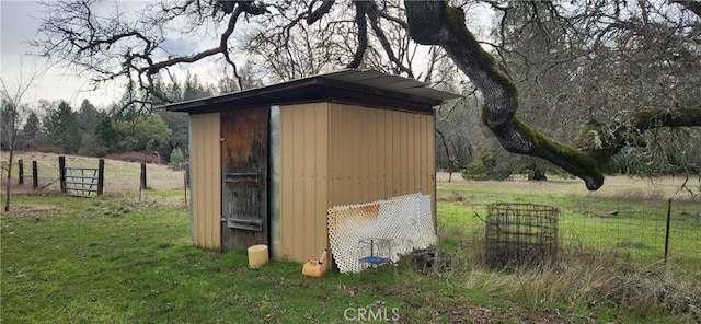 view of shed featuring fence