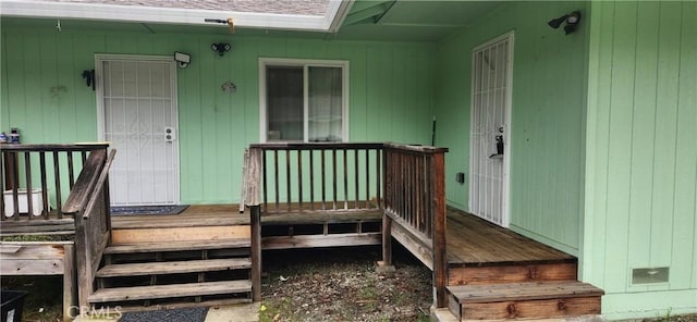 view of exterior entry with a porch