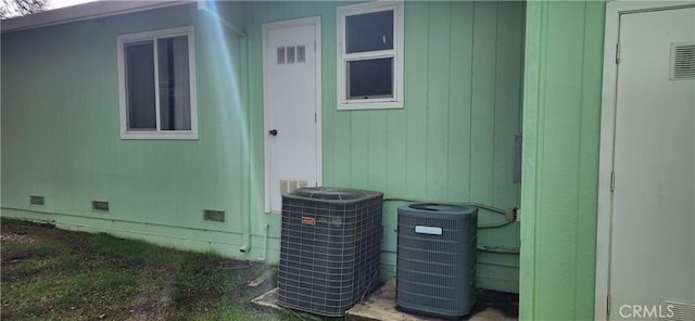 exterior details with crawl space, central AC, and visible vents