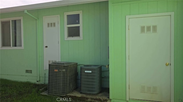 exterior space with central AC unit and a heating unit