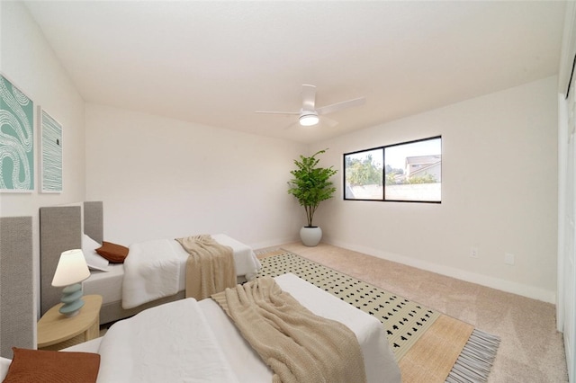 bedroom with carpet flooring, ceiling fan, and baseboards