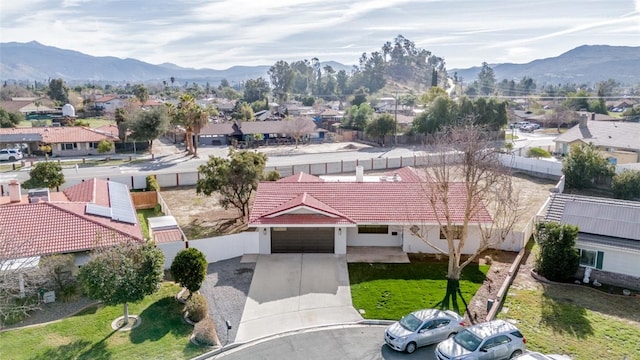 drone / aerial view featuring a residential view and a mountain view