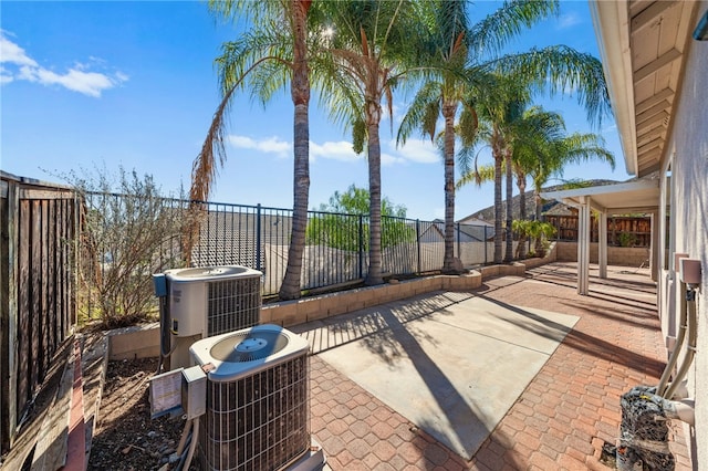 view of patio featuring a fenced backyard and central air condition unit