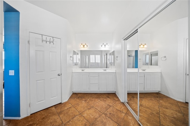 bathroom featuring double vanity and a sink