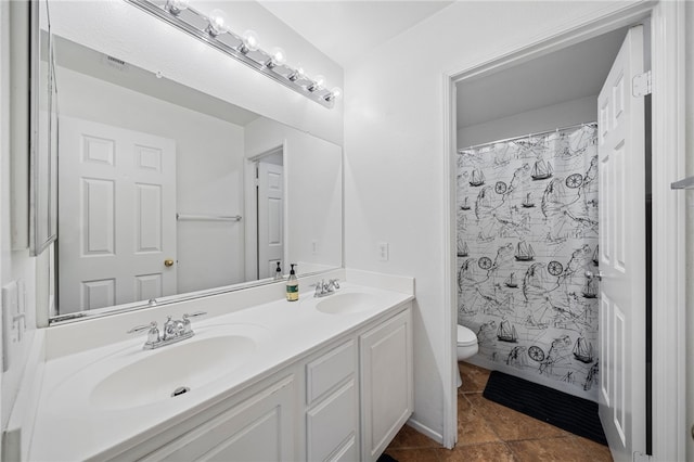 bathroom with toilet, curtained shower, double vanity, and a sink