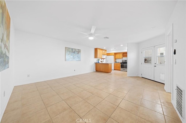 unfurnished living room featuring light tile patterned floors, ceiling fan, visible vents, and recessed lighting