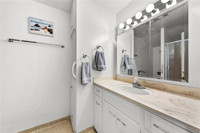 full bathroom with an enclosed shower and vanity