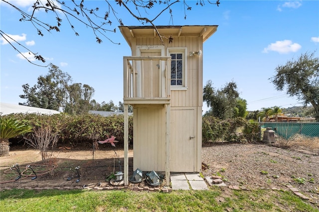 view of shed with fence