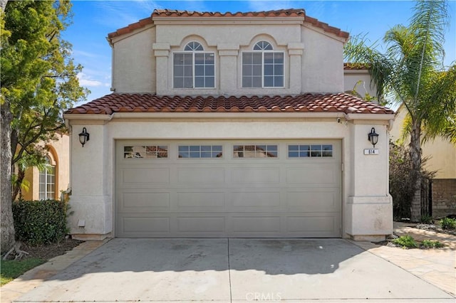 garage with concrete driveway