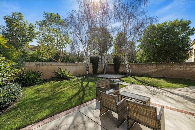 view of patio featuring outdoor dining area and a fenced backyard