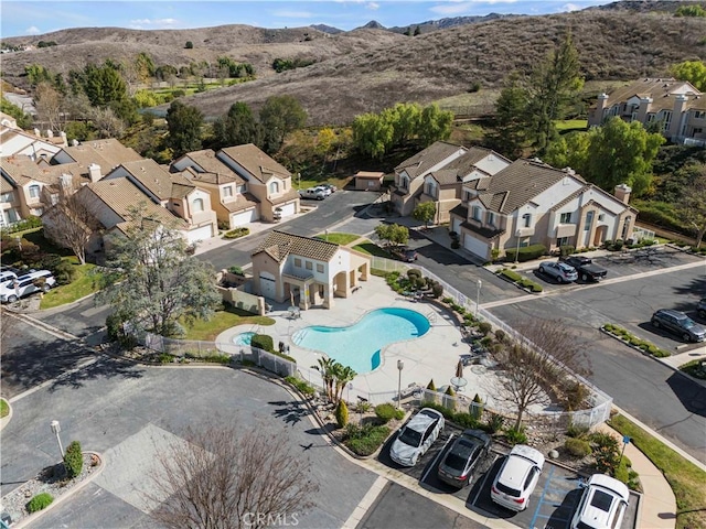 drone / aerial view with a residential view and a mountain view