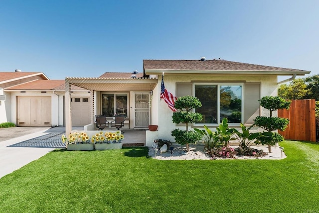 view of front of property with a garage, concrete driveway, fence, a front lawn, and stucco siding