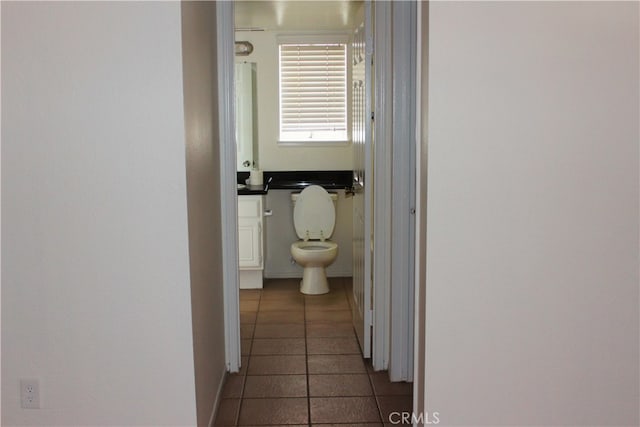 hall with light tile patterned flooring