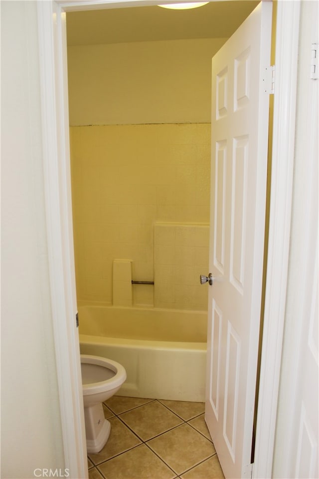 bathroom with toilet and tile patterned floors