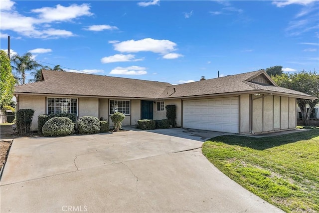 single story home featuring a garage, a shingled roof, driveway, stucco siding, and a front lawn