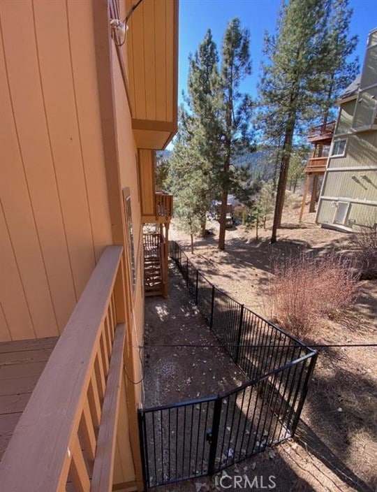 wooden terrace with stairway and fence