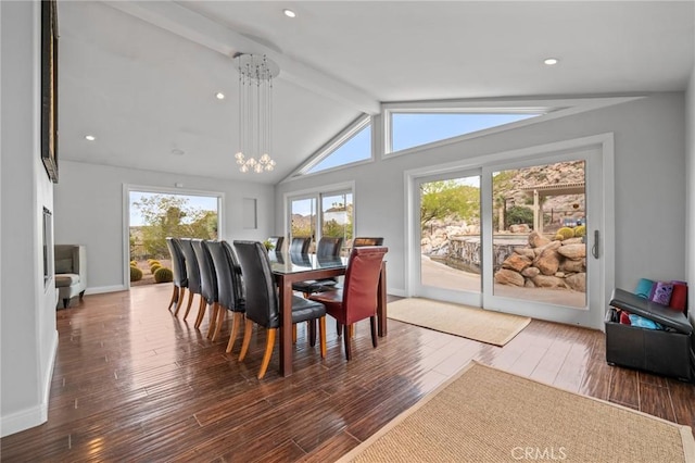 dining space featuring lofted ceiling with beams, baseboards, and wood finished floors