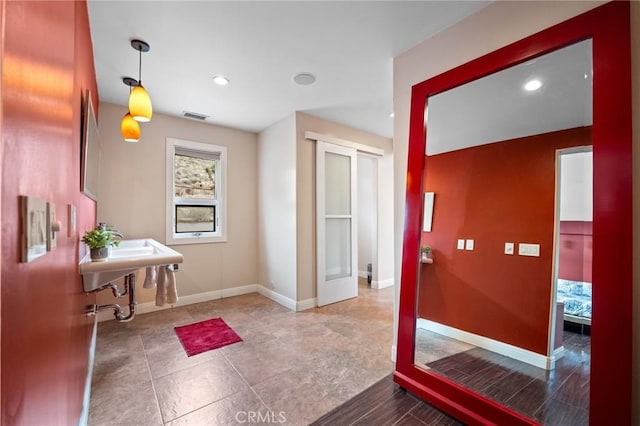 interior space with recessed lighting, visible vents, and baseboards