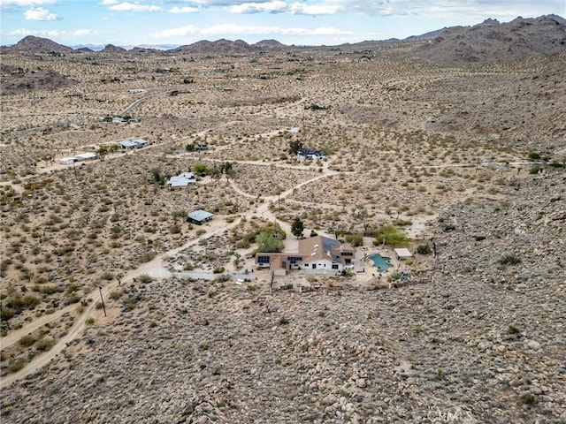 bird's eye view with a mountain view and view of desert