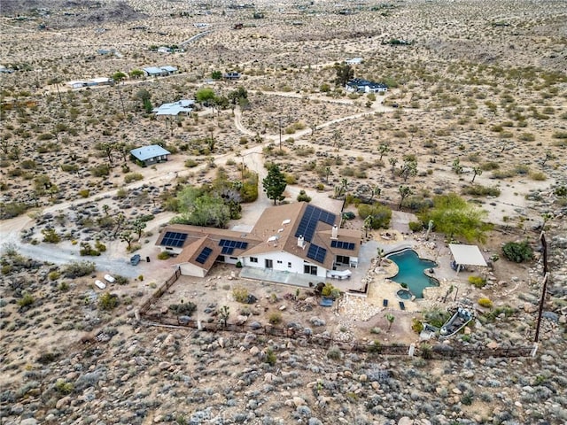 birds eye view of property featuring view of desert