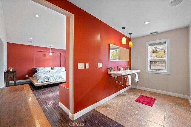 bathroom featuring recessed lighting, visible vents, and baseboards