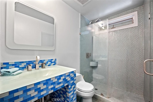 bathroom with toilet, a stall shower, tasteful backsplash, and visible vents