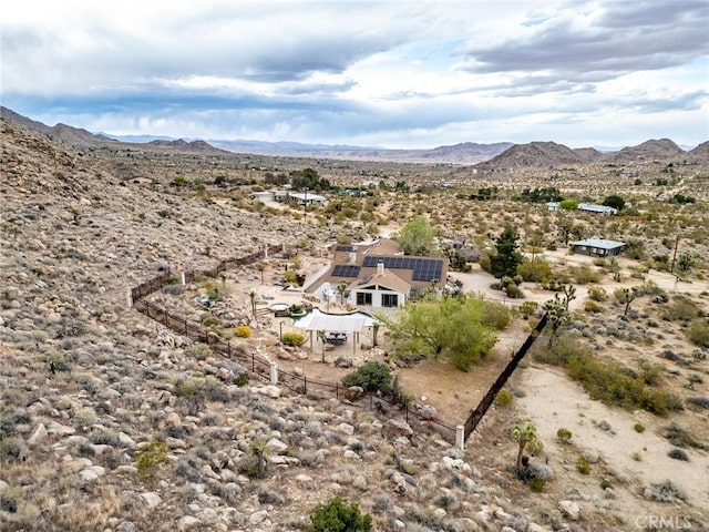 birds eye view of property with a desert view and a mountain view