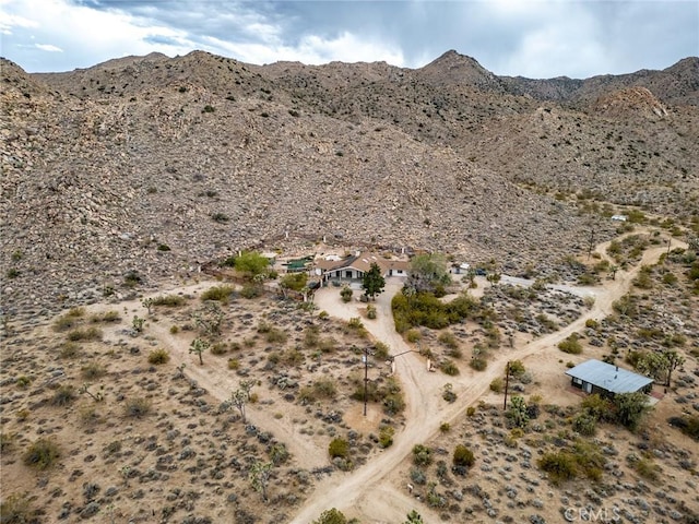 drone / aerial view with a mountain view and view of desert