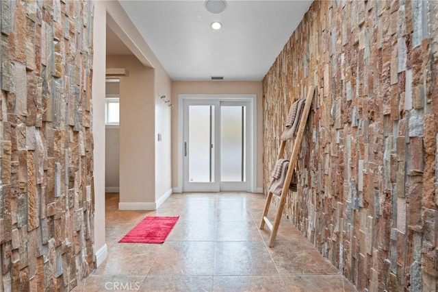 entryway with visible vents and baseboards