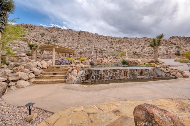 view of patio featuring a mountain view