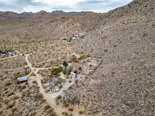 drone / aerial view with a desert view and a mountain view