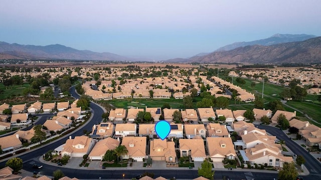 drone / aerial view with a residential view and a mountain view