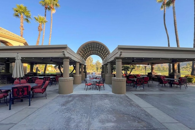 view of patio featuring outdoor dining area and a gazebo