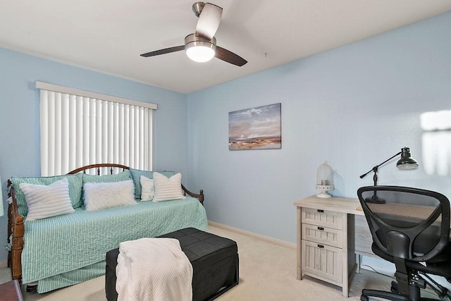 bedroom with baseboards, ceiling fan, and light carpet