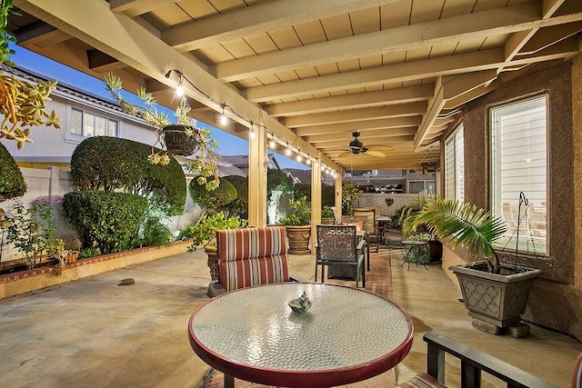 view of patio with outdoor dining area and ceiling fan