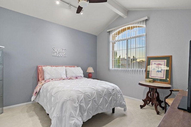 bedroom with baseboards, lofted ceiling with beams, carpet flooring, and a ceiling fan