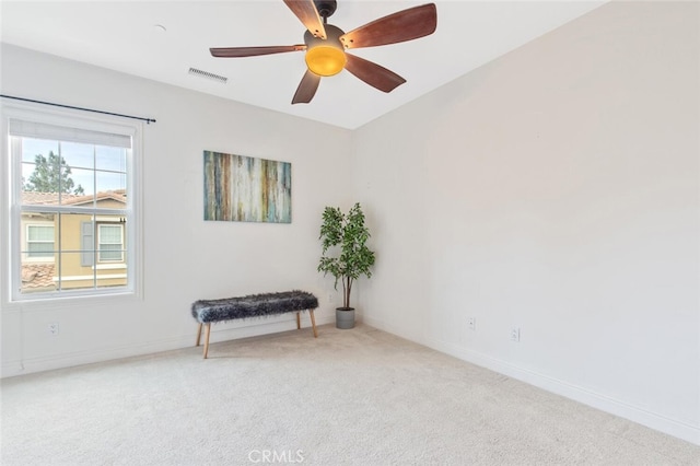 unfurnished room with baseboards, visible vents, ceiling fan, and carpet flooring