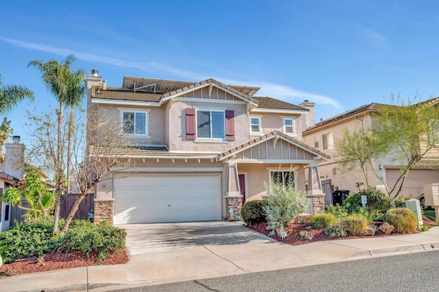 craftsman-style home with a garage, stone siding, driveway, and stucco siding