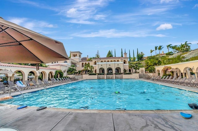 community pool featuring a patio area