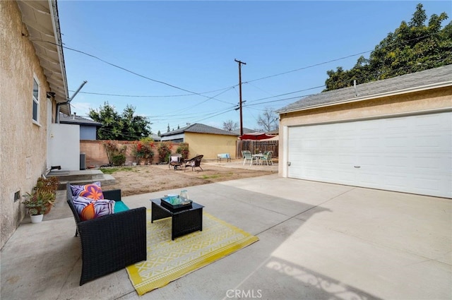 view of patio with a garage and a fenced backyard