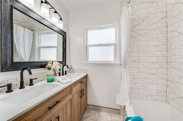 bathroom featuring double vanity, shower / bath combo, decorative backsplash, and a sink