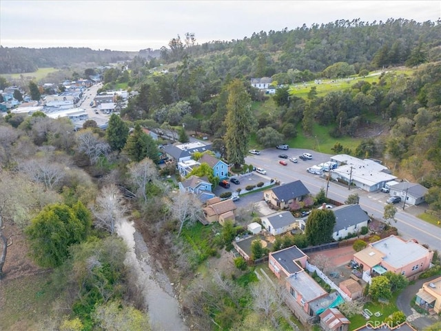 aerial view featuring a residential view and a forest view