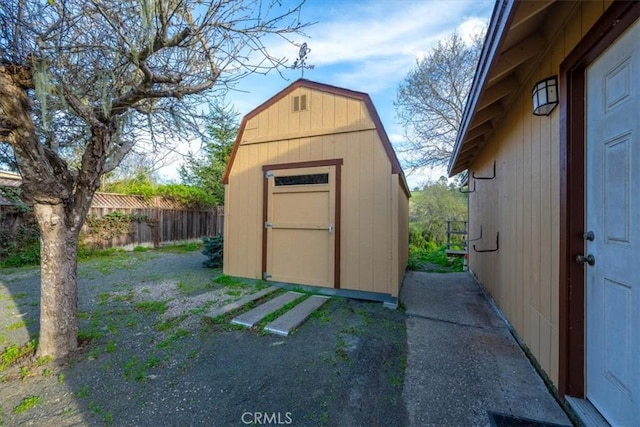 view of shed with fence