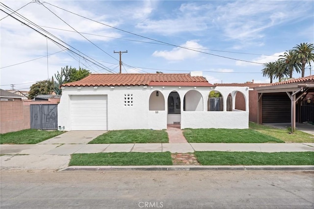 mediterranean / spanish home with a garage, concrete driveway, a tile roof, fence, and stucco siding