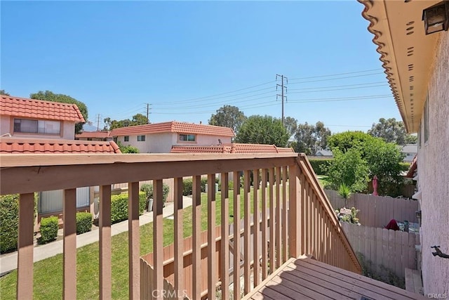 wooden terrace featuring fence