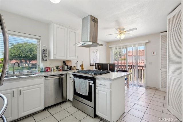 kitchen with stainless steel appliances, white cabinetry, and island exhaust hood