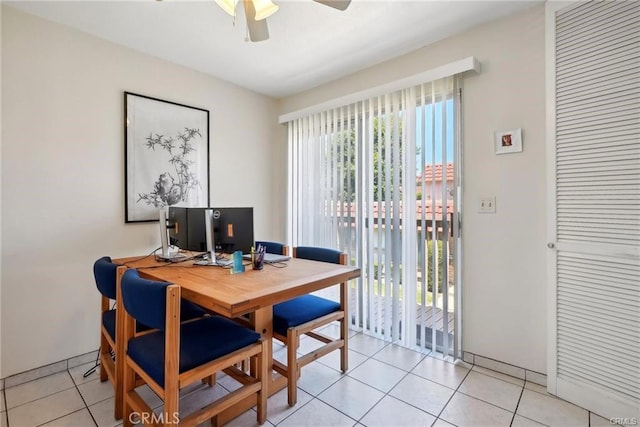 dining room featuring a ceiling fan and light tile patterned floors