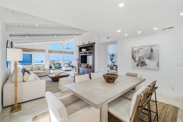 dining room with vaulted ceiling with beams, baseboards, visible vents, and recessed lighting